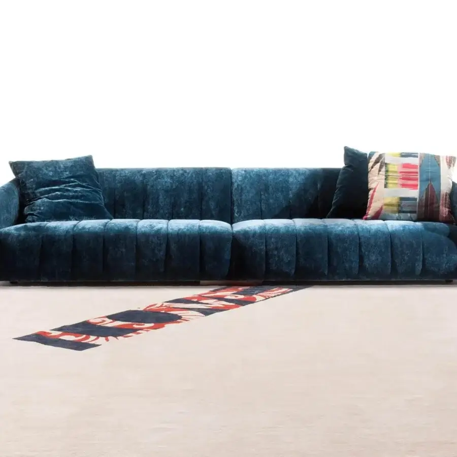 Lavish Erba Belladonna sofa with quilted detailing upholstered in deep teal velvet-like textile and solid wood construction