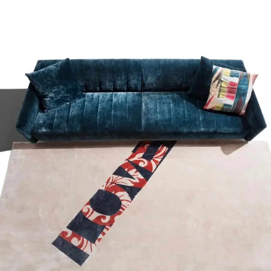 Distinguished Erba Belladonna sofa with cozy shapes and soft padding upholstered in deep teal textile with refined quilting