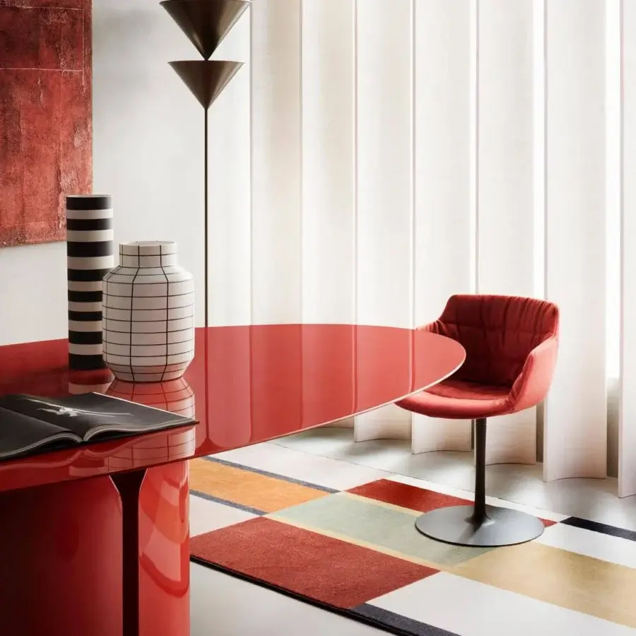 Elegant MDF Italia NVL table crafted in glossy red lacquered molded high-density rigid polyurethane with a rounded form