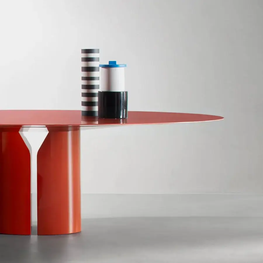Superior MDF Italia NVL table crafted in reddish-orange lacquered molded high-density rigid polyurethane with floating oval tabletop