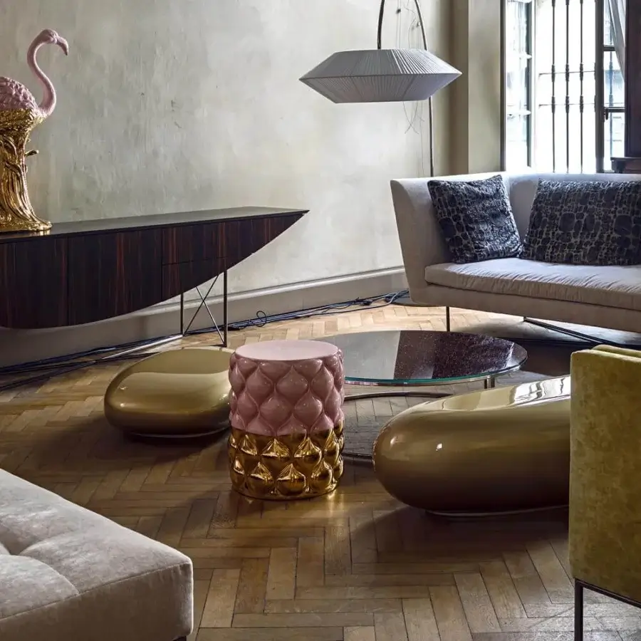Exclusive Erba Invece ottoman crafted in light pink quilted polymeric material with glossy gold base