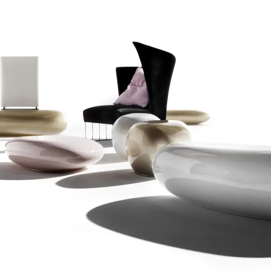 Superior Erba Invece ottoman with curvaceous form crafted in light pink polymeric material and glossy finish