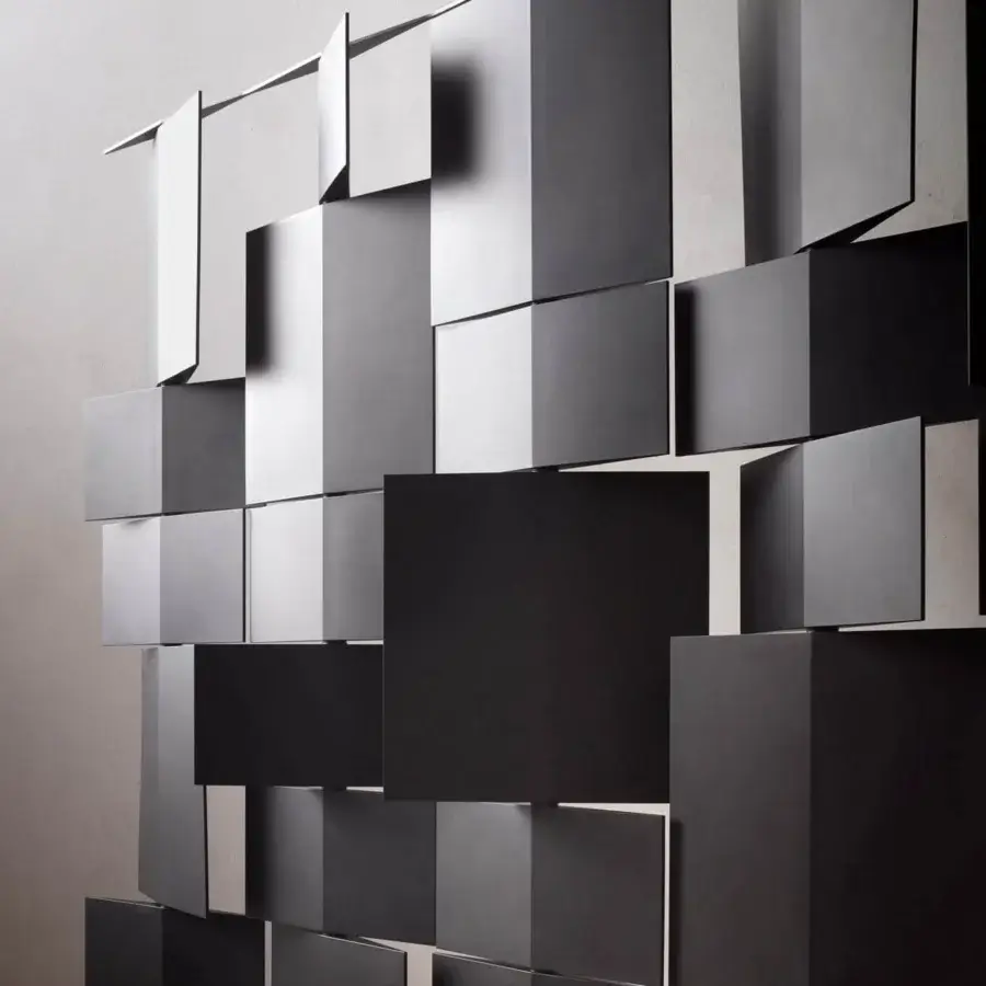 Avant-garde MDF Italia Divide It room divider with interconnected matte black integral polyurethane panels and linear support