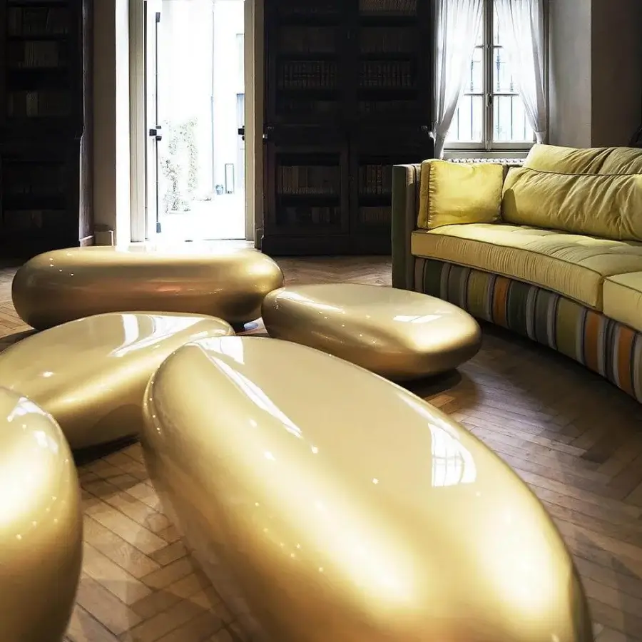 Distinctive Erba Invece coffee table crafted from polymeric materials with a smooth glossy gold finish