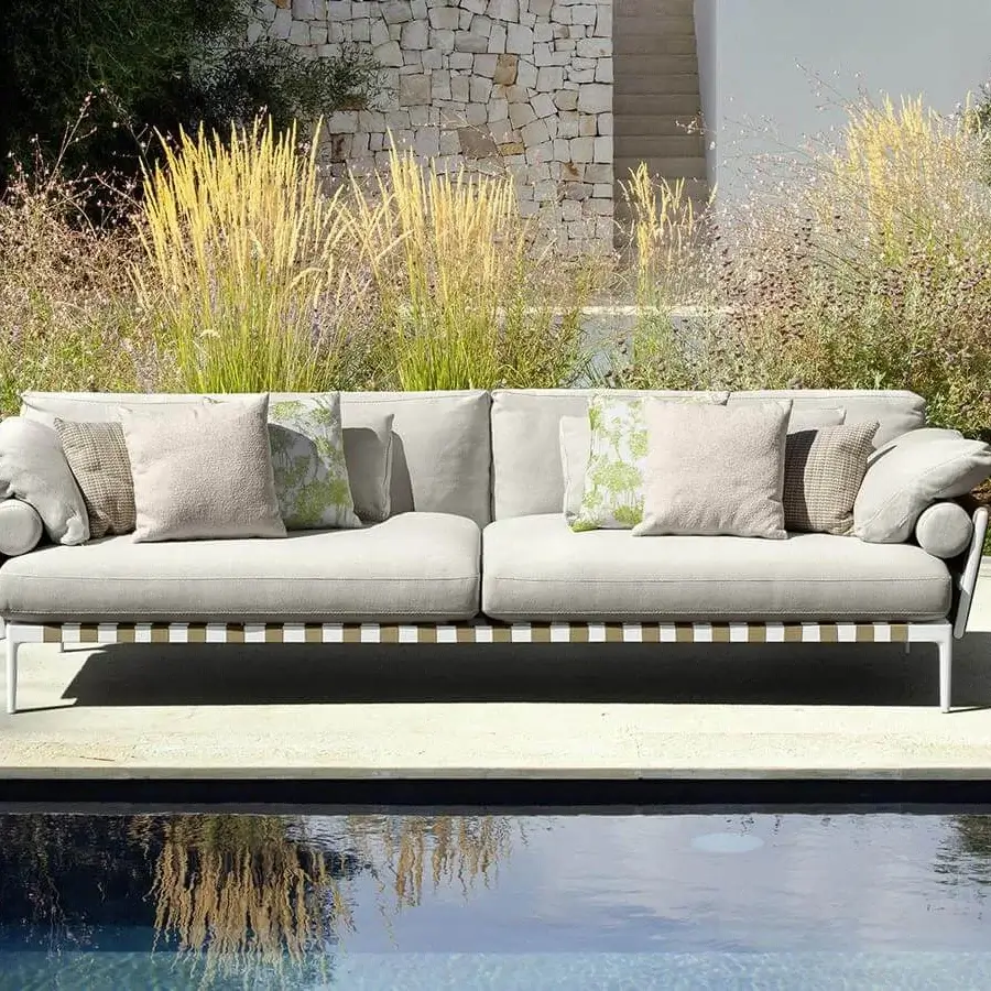 Elegant Talenti Salinas sofa with light gray fabrics and matte white metal frame evokes natural timeless charm