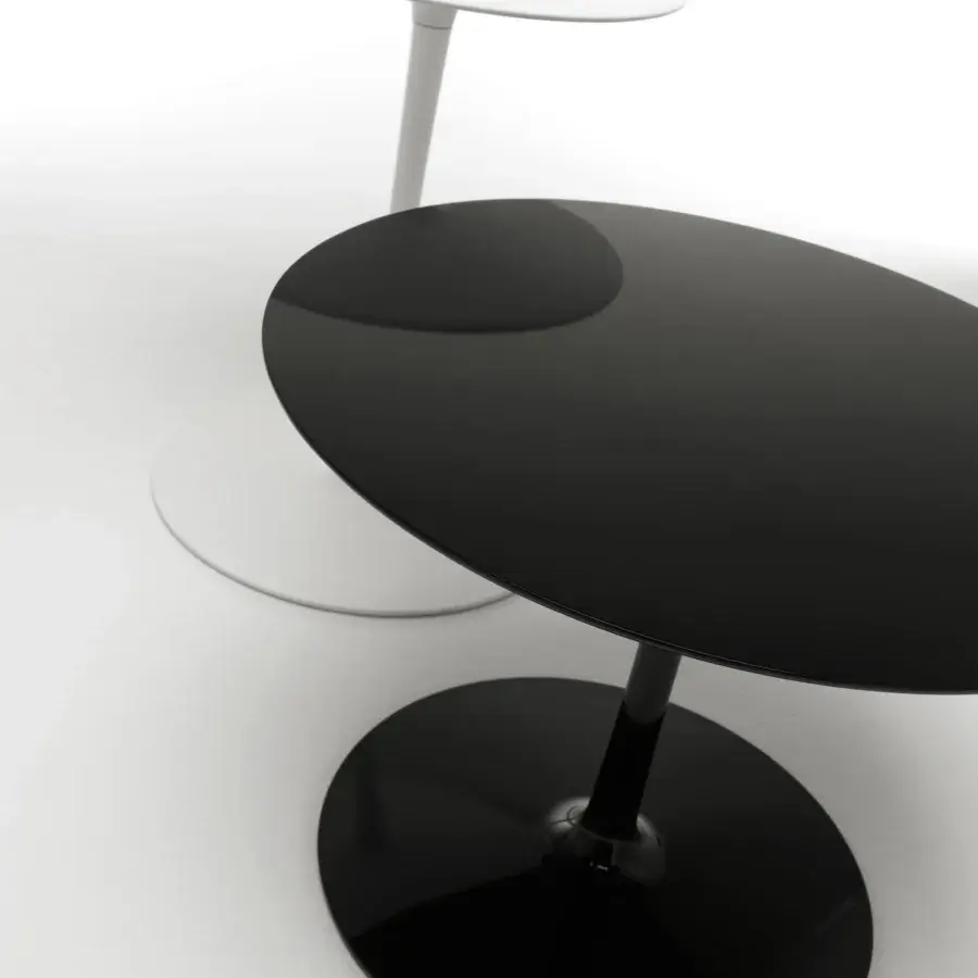 Captivating MDF Italia Flow coffee table with circular design in glossy black Ceramilux® exhibiting sleek reflective surfaces