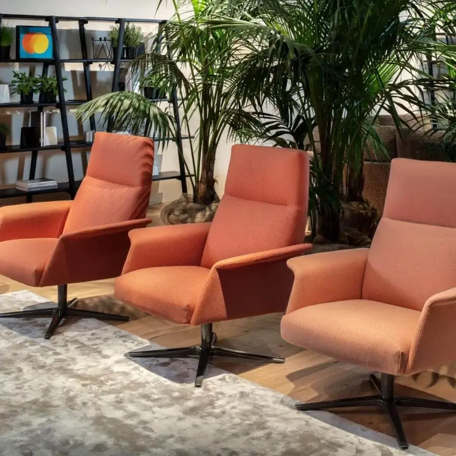 Distinguished Verzelloni Nilson lounge chair with textured matte orange textile and black metal four-star swivel base