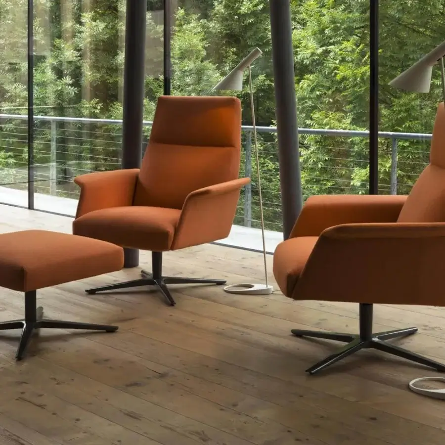 Exclusive Verzelloni Nilson lounge chair with vibrant orange woven textile and sleek dark metal swiveling base