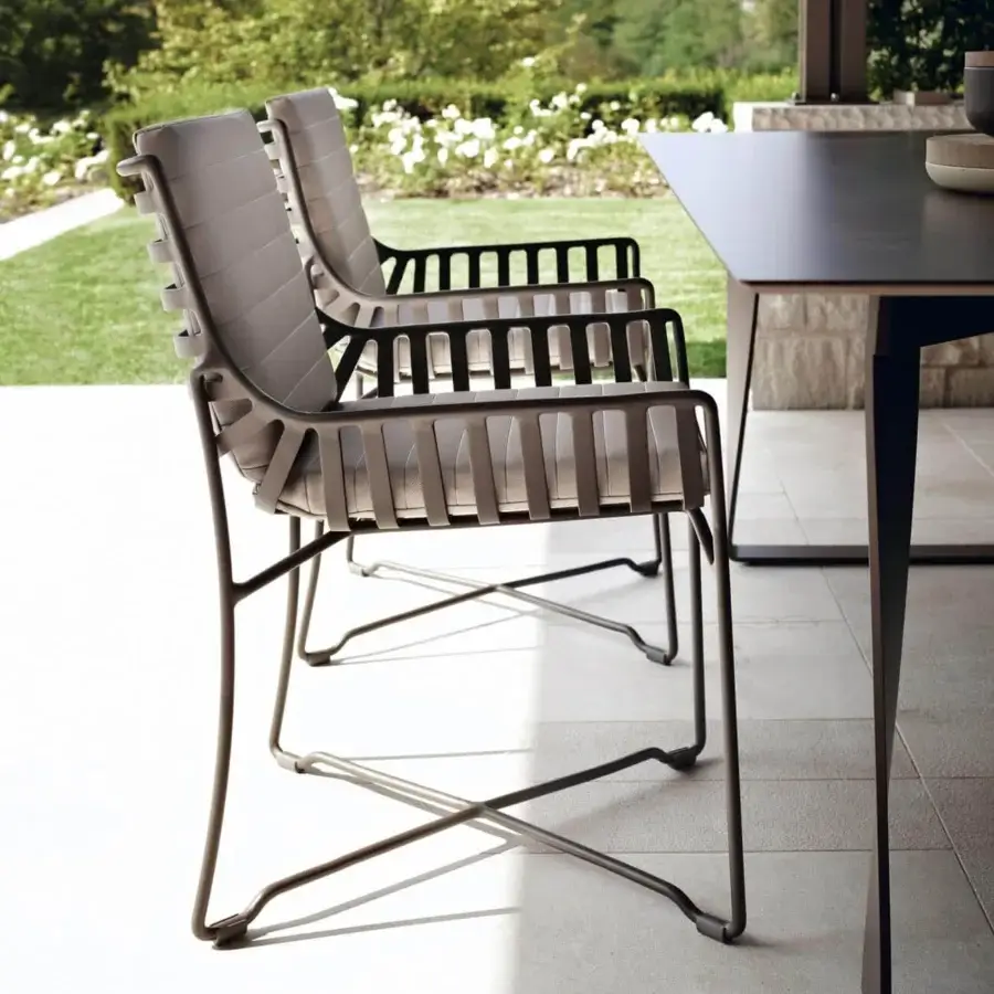 Distinctive Roberti Rattan Hamptons Graphics armchair with powder-coated aluminum frame and lighter gray seating elements