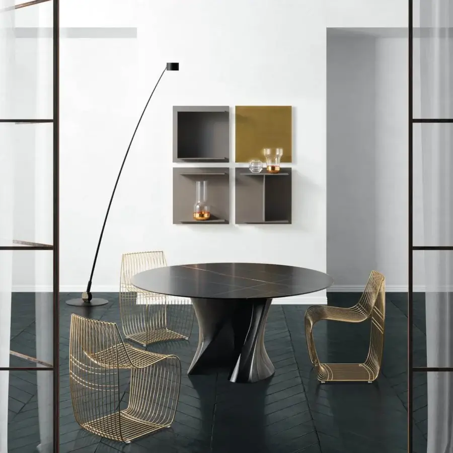 Sophisticated MDF Italia S table with sculptural base crafted in gloss black Ceramilux® and dark Sahara marble tabletop in matte finish
