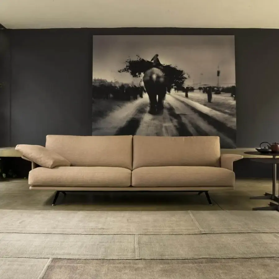 Elegant Verzelloni Nilson sofa upholstered in light beige textile with matte finish and dark angular legs