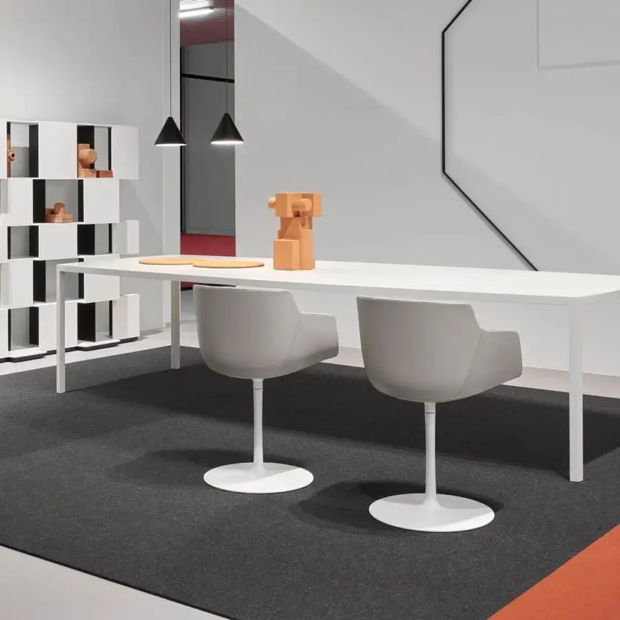 Distinguished MDF Italia Tense Curve table with uniformly white resin top and slender steel legs embodies simplicity