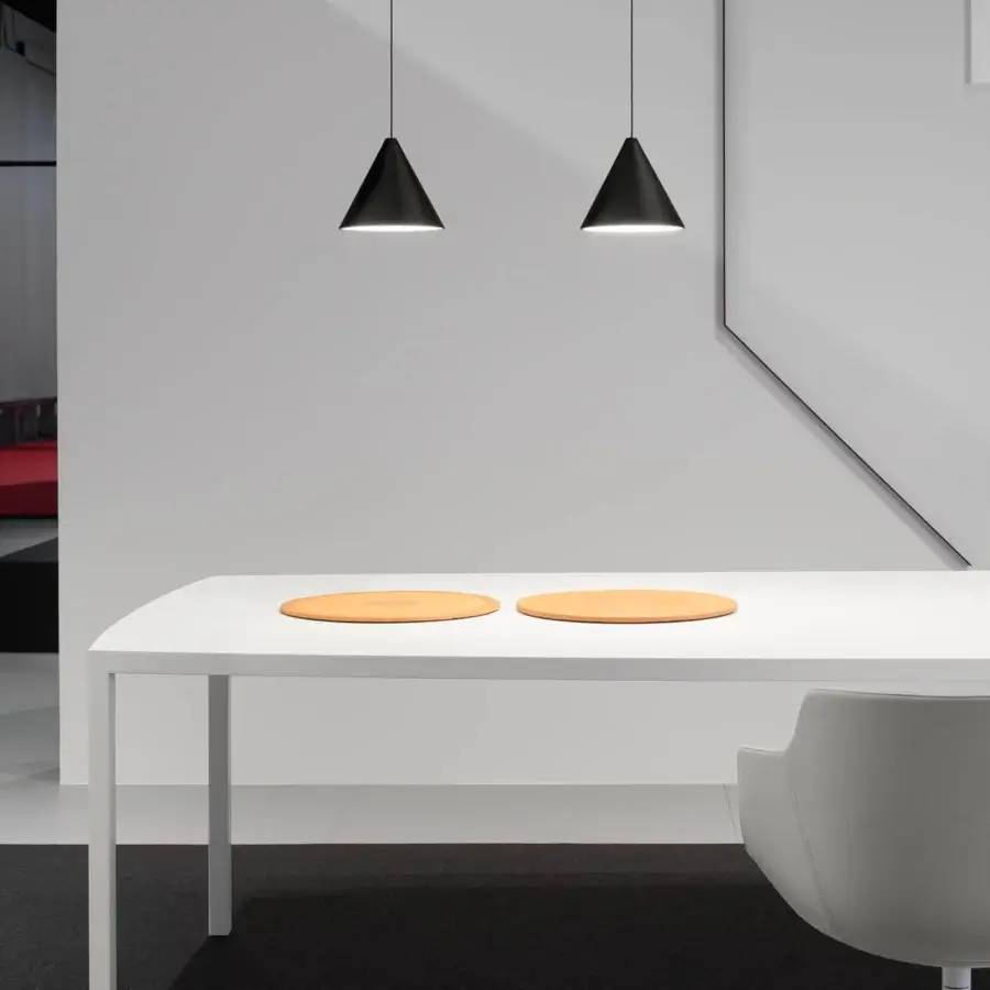 Elegant MDF Italia Tense Curve table with smooth white resin surface and slender steel legs in matte finish