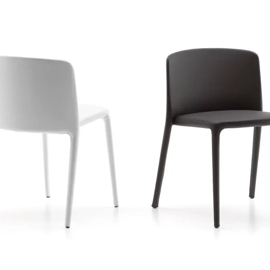 Distinguished MDF Italia Achille chair crafted in dark finish with unified structure and slender metal legs upholstered in removable fabric or leather