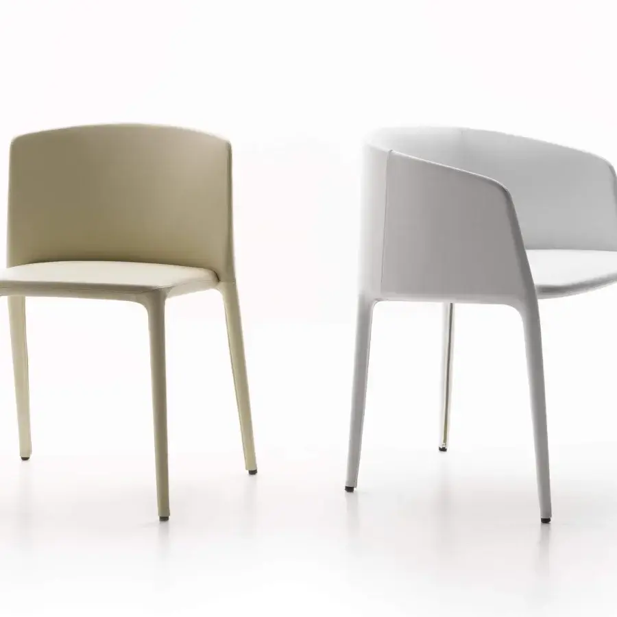Distinguished MDF Italia Achille chair with fully upholstered design and smooth matte finish built with metal tubing and polyurethane rubbers