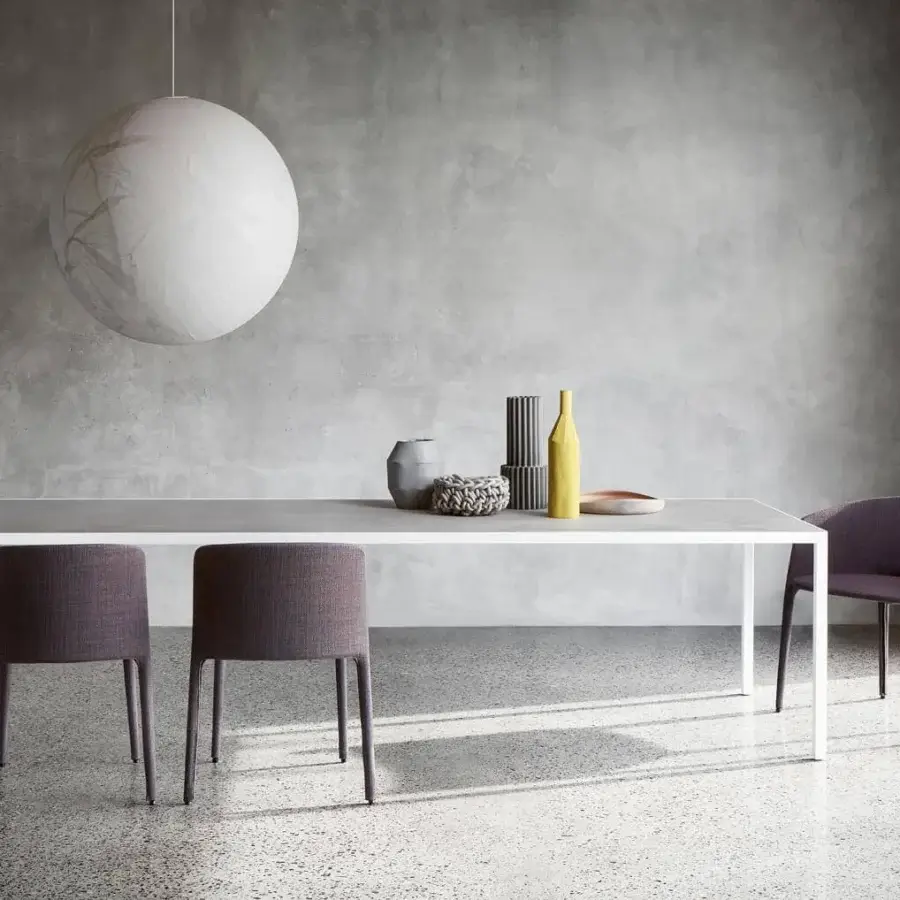 Distinguished MDF Italia Achille armchair fully upholstered in muted purplish-brown textile with a metal tubing frame