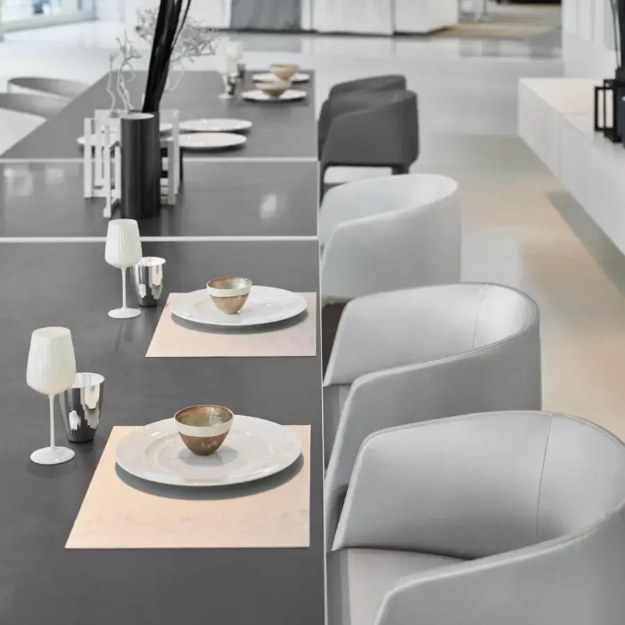 Superior MDF Italia Achille armchair fully upholstered in light grey textile with curved silhouette and metal tubing frame