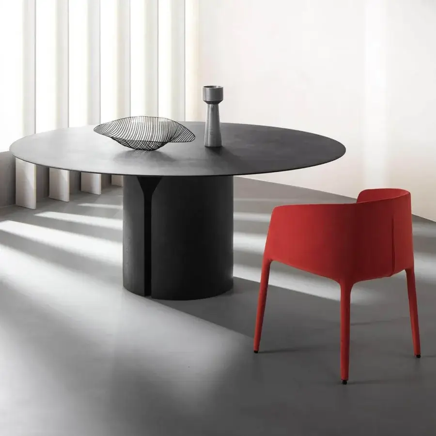 Elegant MDF Italia Achille armchair upholstered in red fabric with a metal tubing frame foamed with polyurethane rubbers