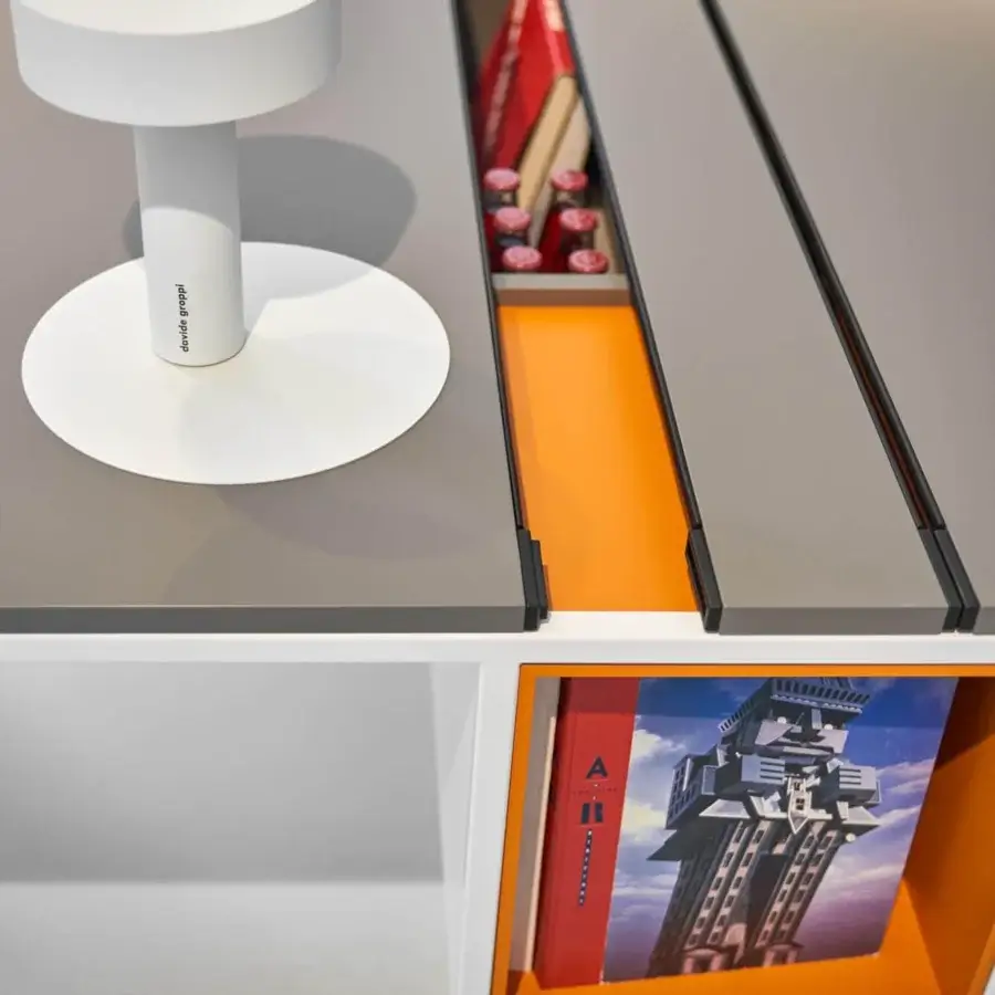 Sophisticated MDF Italia 20.Venti workstation with a light grey Fenix NTM laminate tabletop and white epoxy powder-coated steel frame with orange accents
