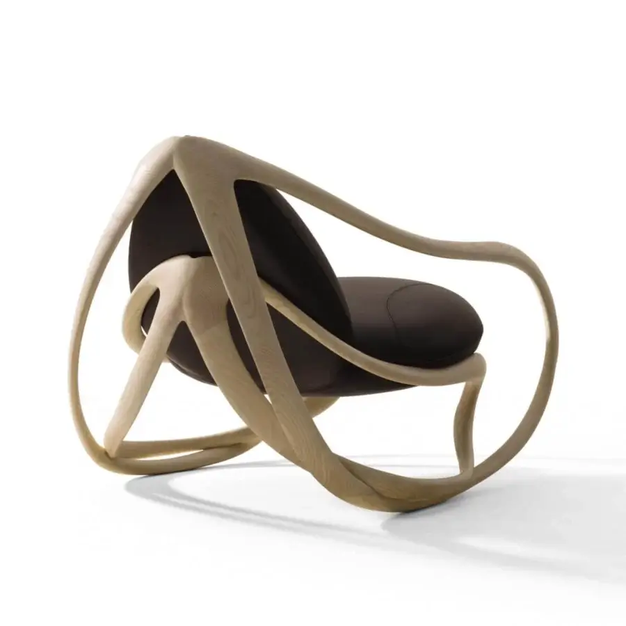 Elegant Giorgetti Move lounge chair with light-toned solid ash wood structure and dark leather-like upholstery