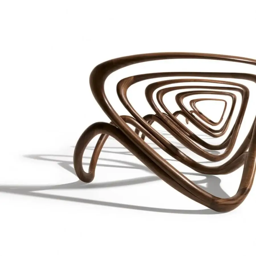 Exceptional Giorgetti Hug lounge chair with sculpted canaletto walnut framing and softly shaped brown upholstery exhibiting a smooth sheen