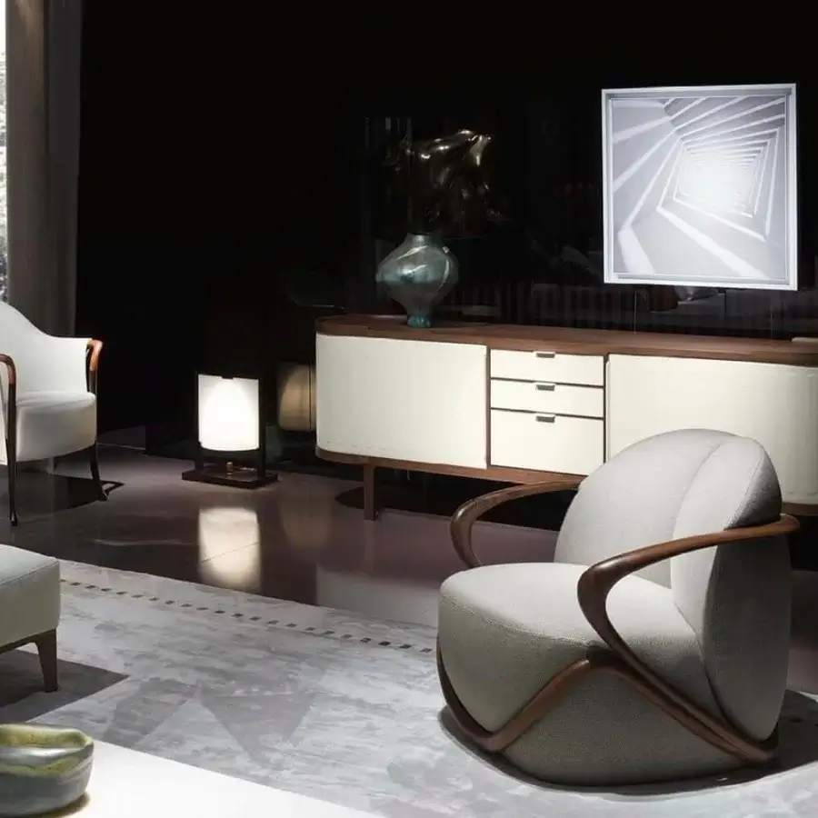 Superior Giorgetti Hug lounge chair with a frame crafted from canaletto walnut and light gray textile upholstery