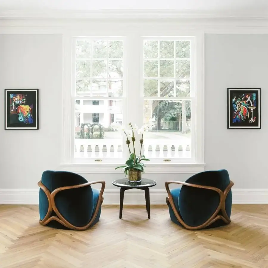 Exceptional Giorgetti Hug lounge chair in deep teal textile with a matte canaletto walnut frame crafted from twenty solid pieces