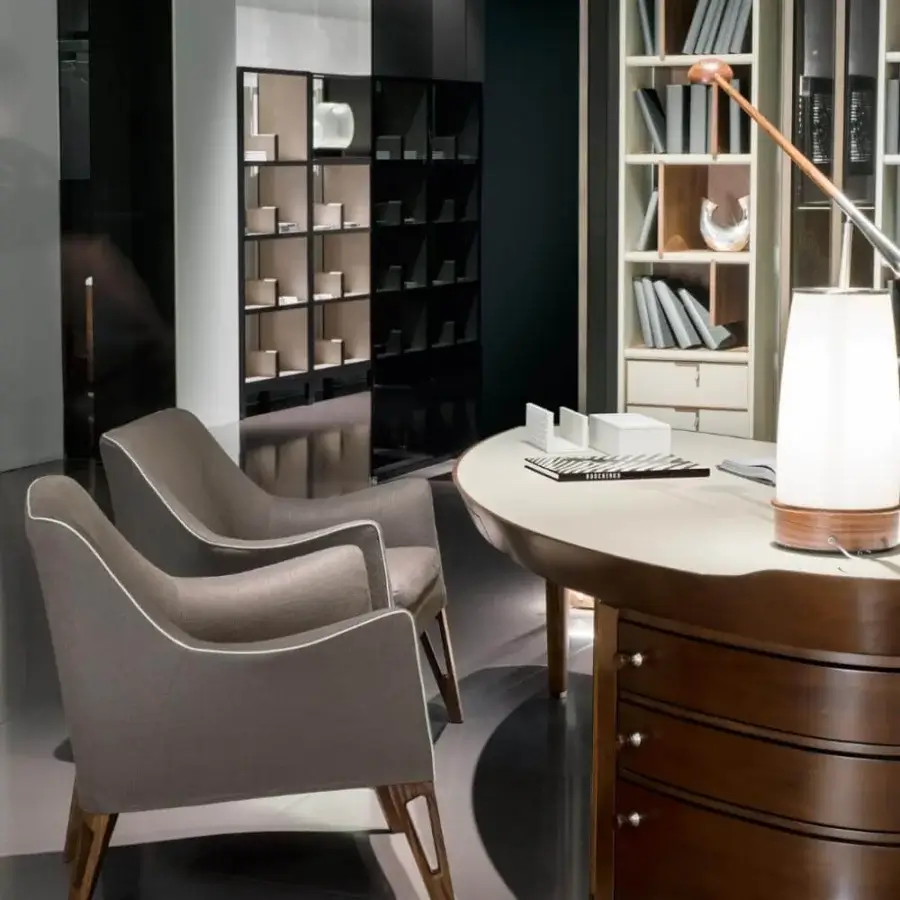 Distinguished Giorgetti Erasmo desk with fluid lines built in canaletto walnut and a saddle leather leaf-shaped top with metal hardware