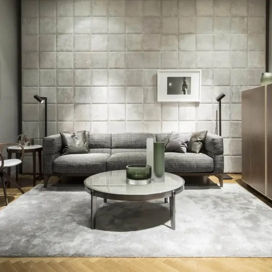 Elegant Giorgetti Norah armchair with a curved silhouette crafted in canaletto walnut and pristine white textile with bronze-varnished metal accents