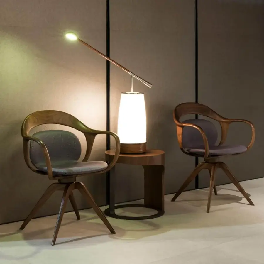 Exclusive Giorgetti Norah armchair with a swivel structure built in canaletto walnut and soft gray textile seat