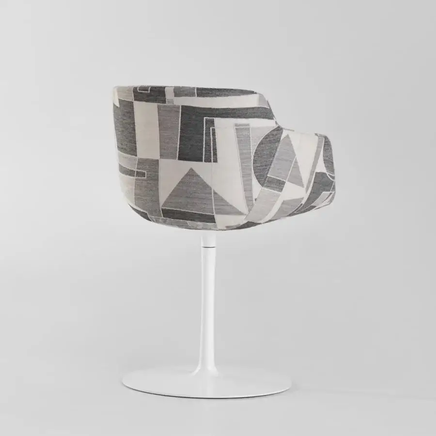 Distinguished MDF Italia Flow chair with striking geometric patchwork upholstery in grays, whites and blacks with a matte white aluminum base
