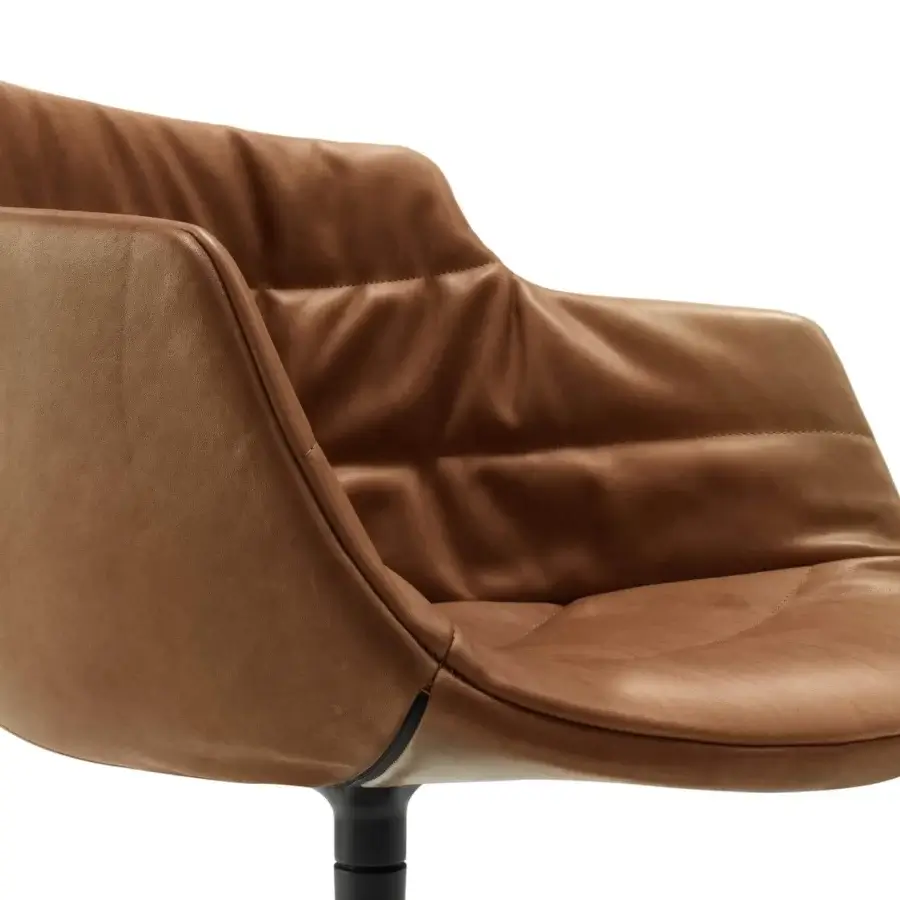 Superior MDF Italia Flow Textile chair with curved silhouette upholstered in light brown fabric and matte black painted leg base