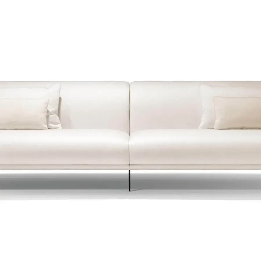 Distinguished Giorgetti Drive sofa with off-white fabric, canaletto walnut feet and bronze painted inserts, outlined by elegant leather piping