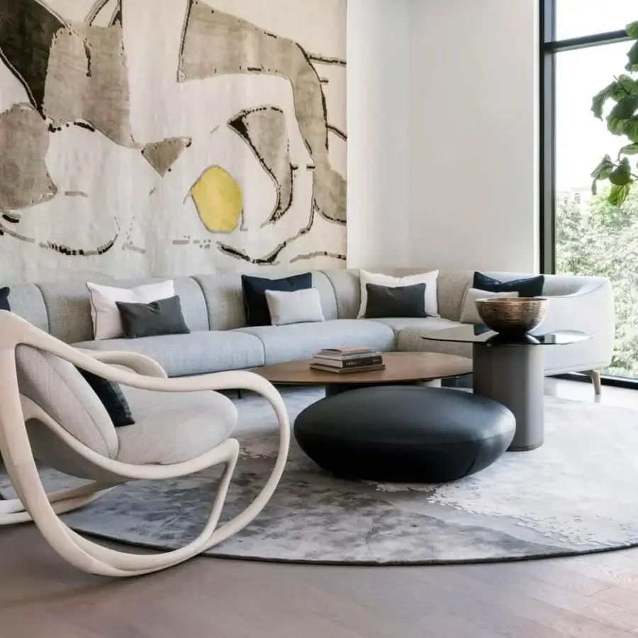 Exceptional Giorgetti Drive sectional with light grey textile upholstery, goose down cushions and canaletto walnut feet with bronze painted inserts