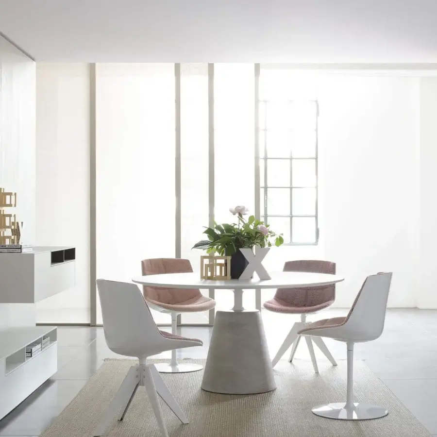 Elegant MDF Italia Flow chair with curved pink textile upholstery and a sophisticated white central stem with circular base