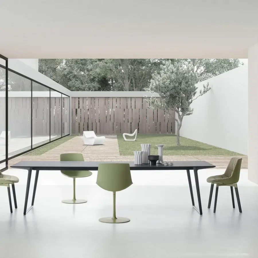 Distinctive MDF Italia Flow chair with a curved seat and sophisticated aluminum base painted with epoxy powder in matte green