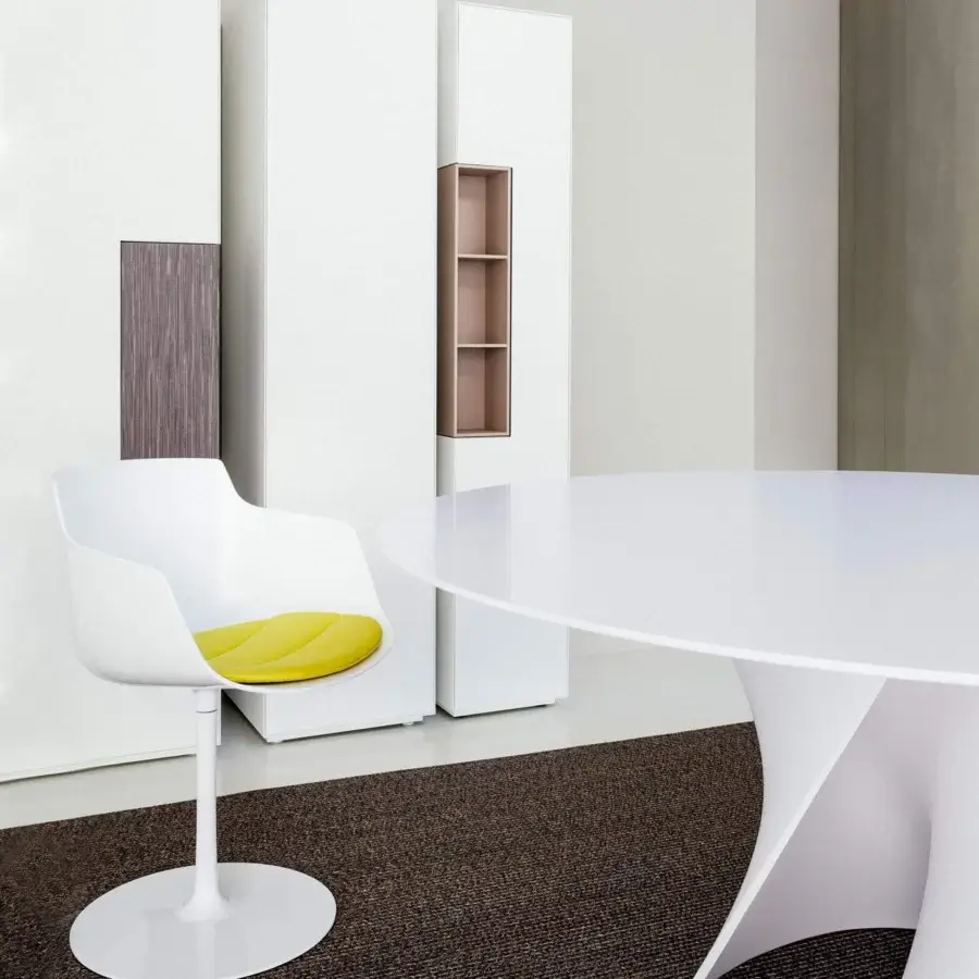 Superior MDF Italia Flow armchair with organic curved form, glossy white finish and vibrant yellow textile seat cushion