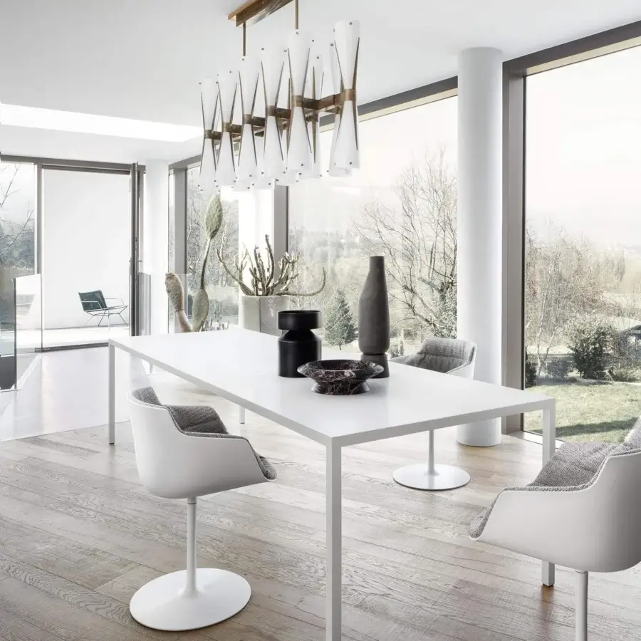 Distinguished MDF Italia Flow armchair with rounded shell upholstered in grey woven textile and white epoxy powder pedestal base