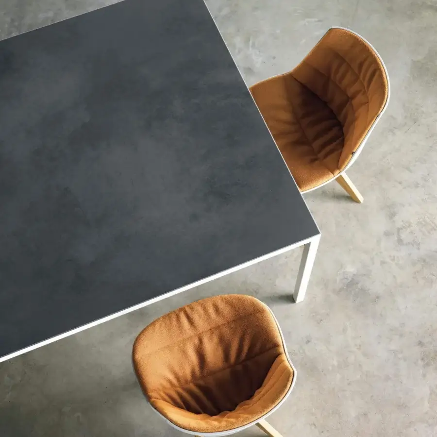 Superior MDF Italia Flow chair with warm brown textured textile and sleek white frame built with elegant wooden legs
