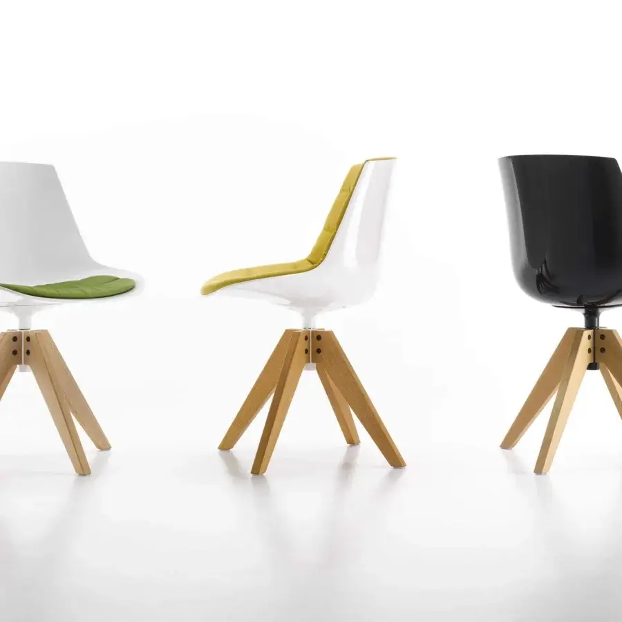 Superior MDF Italia Flow chair with a molded white shell and vibrant green quilted polyurethane cushion built with a light-toned wooden base