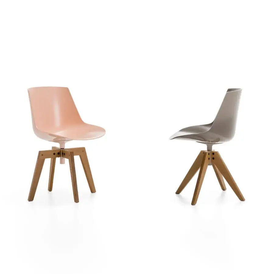 Elegant MDF Italia Flow chair with a molded muted pink seat and matte finish wooden base crafted with a square structure