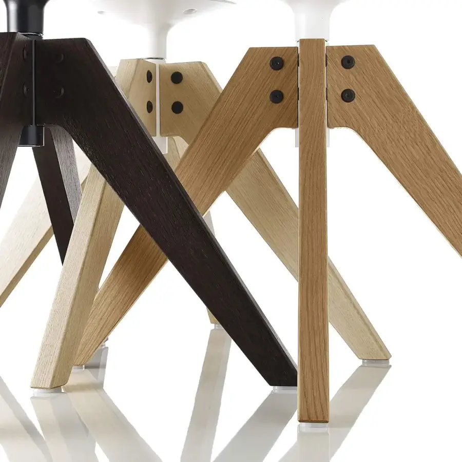 Distinguished MDF Italia Flow chair with wood legs displaying dark brown stained and subtly varied lighter tones