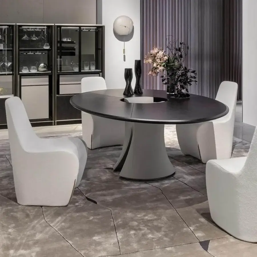 Elegant Giorgetti Tie chair with full volume, textured white fabric upholstery and contrasting beige leather detailing