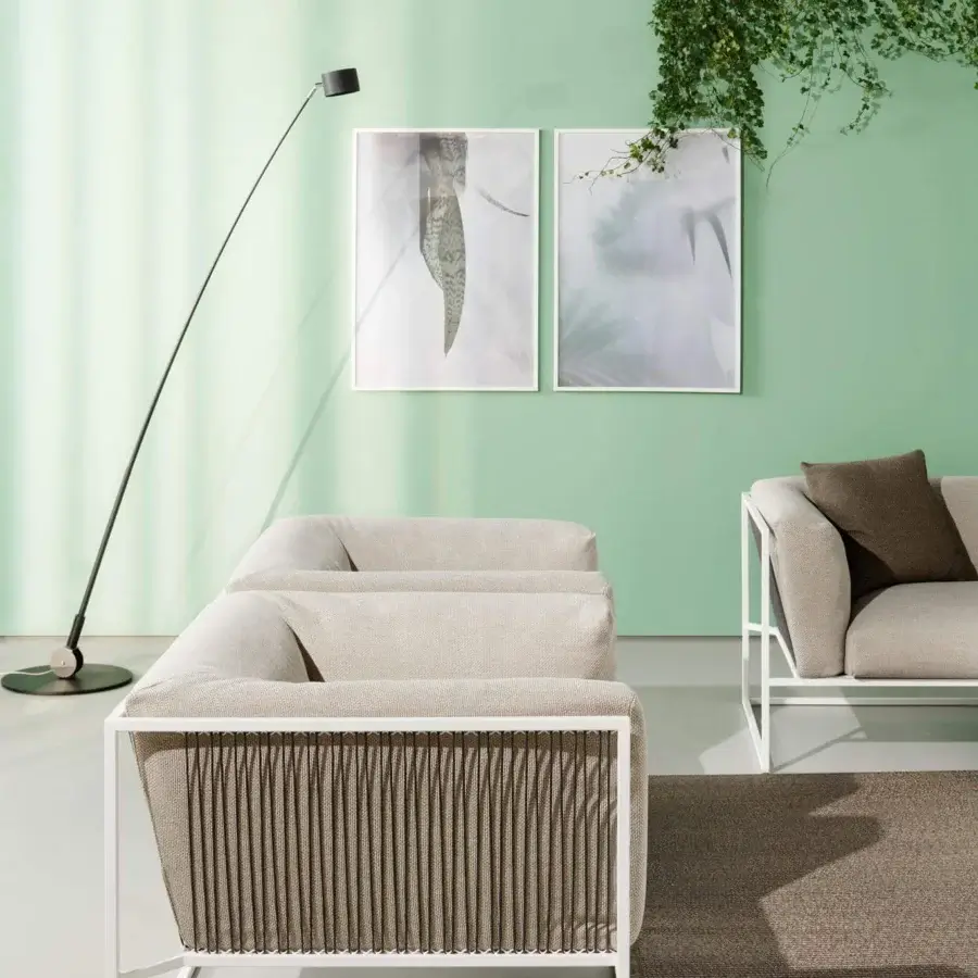 Sophisticated MDF Italia Arpa lounge chair with goffered white epoxy powder coated frame and plush light beige woven cushions