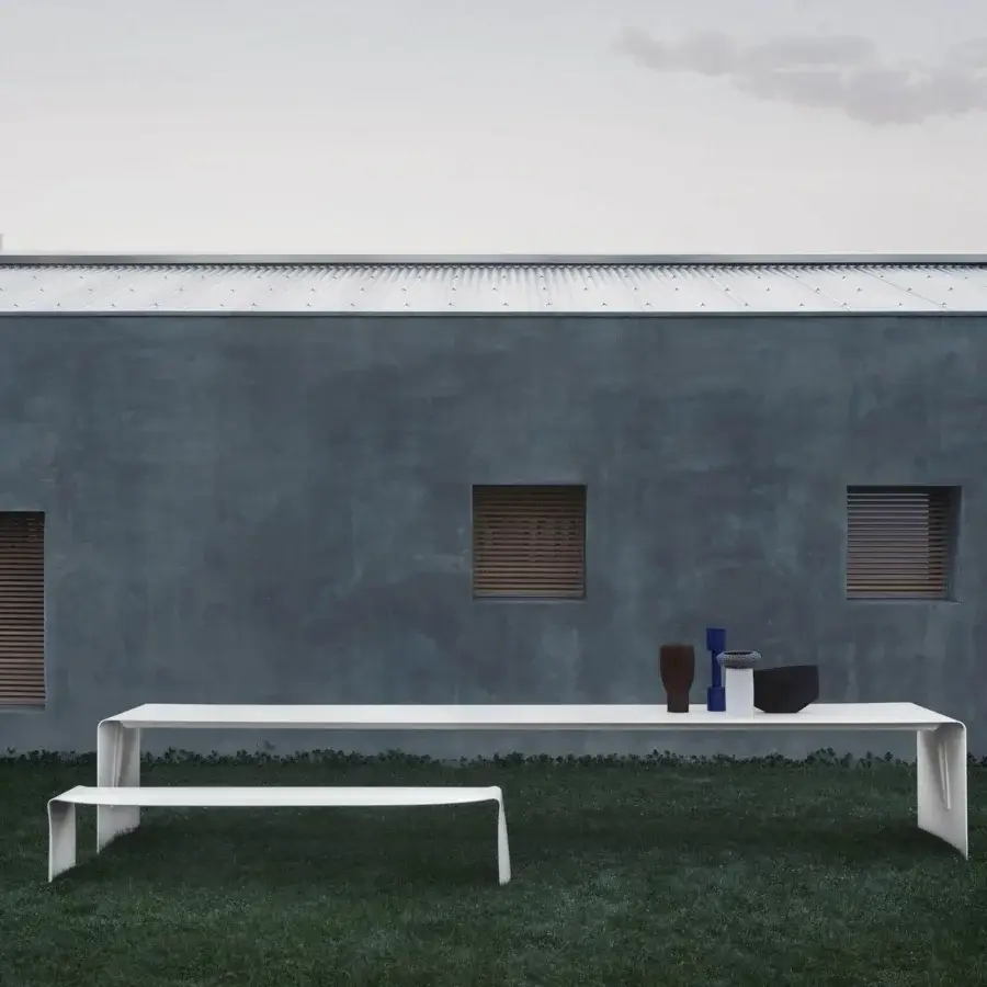 Distinguished MDF Italia La Grande Table presents a curved natural aluminum sheet with a matt painted white finish