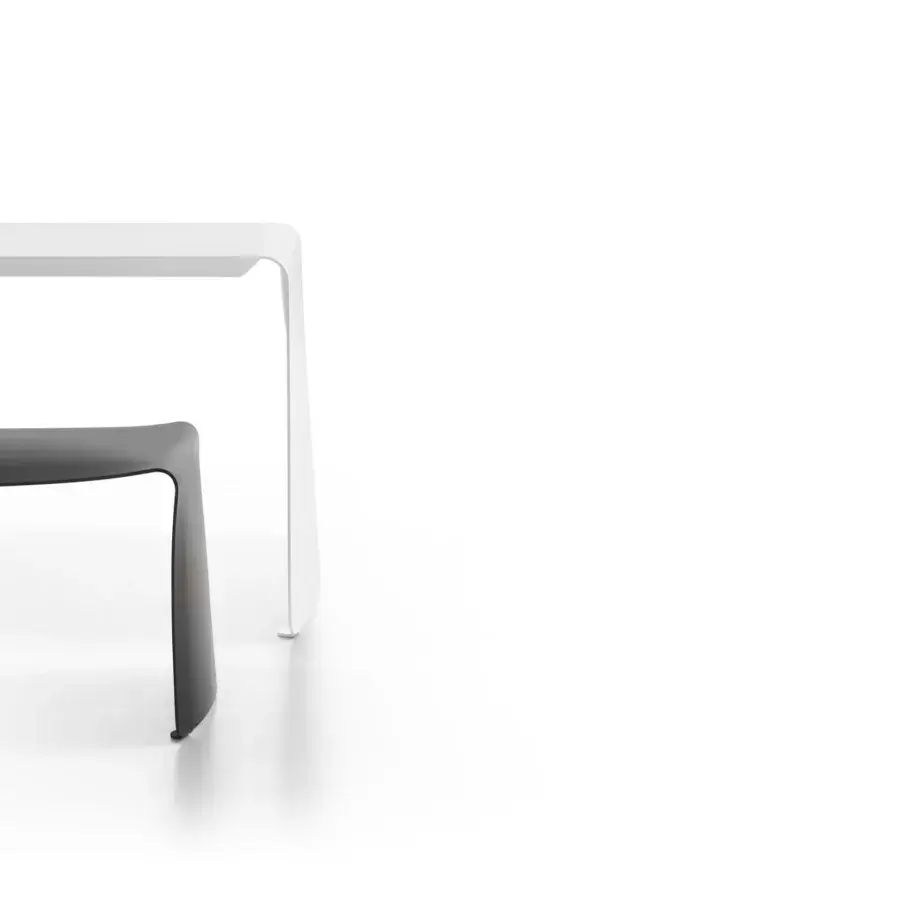 Elegant MDF Italia La Grande table crafted with a curved natural aluminum sheet in a matt painted white finish