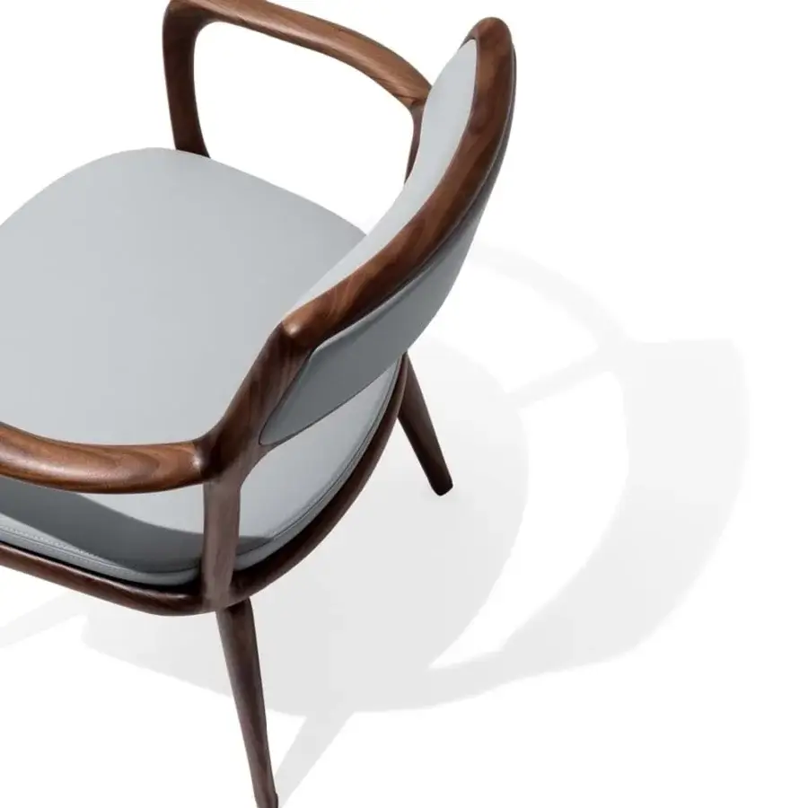 Exceptional Giorgetti Baron armchair with sensual lines and refined grey upholstery in canaletto walnut profiles