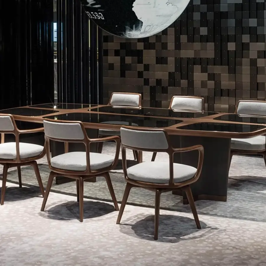 Superior Giorgetti Baron armchair with soft lines and light gray textile upholstery in a matte canaletto walnut frame