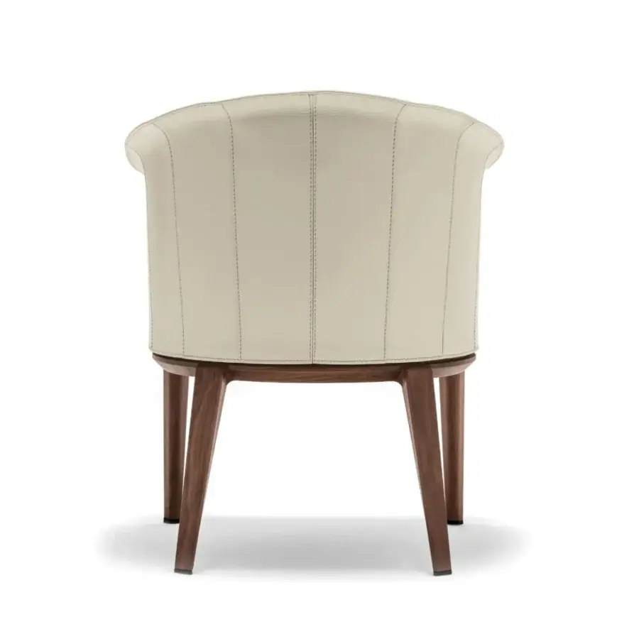 Superior Giorgetti Aura armchair with curved saddle leather and solid canaletto walnut base showcasing skilled Italian craftsmanship