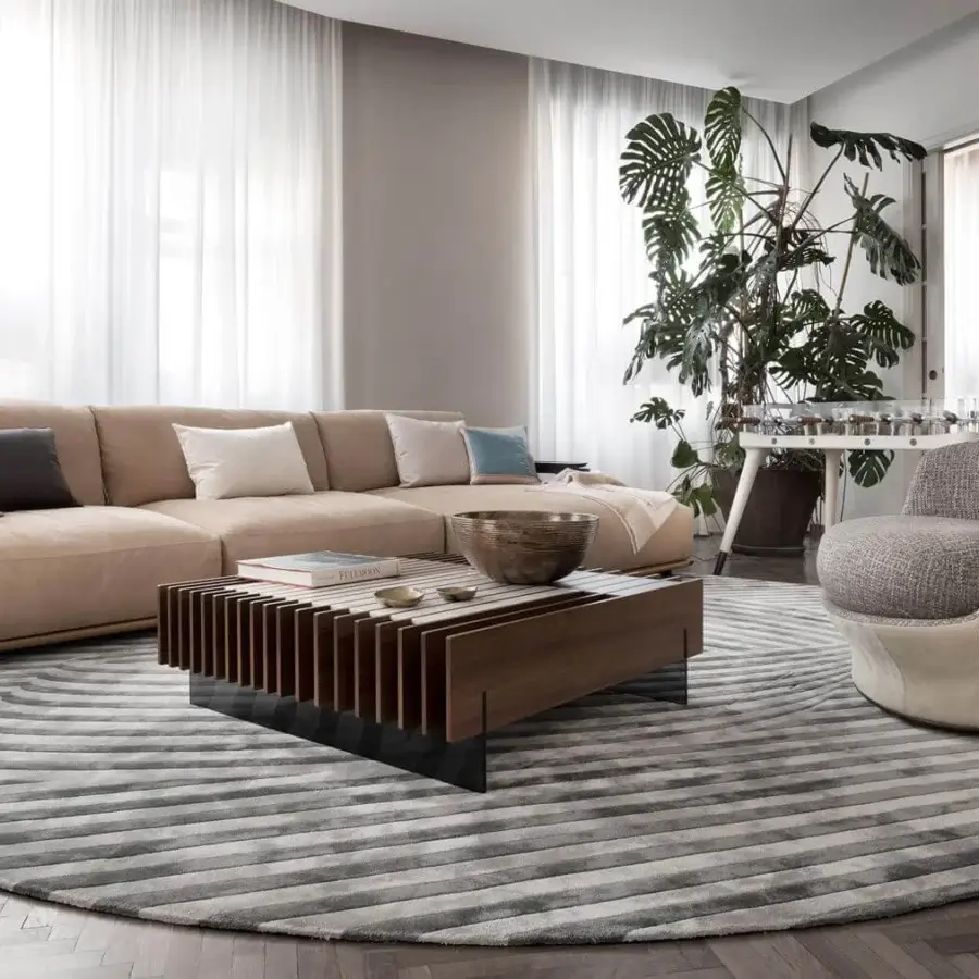 Distinguished Giorgetti Adam sectional with light beige fabric, goose down cushions and pewter painted metal accents